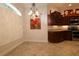 Cozy dining room showcasing built-in cabinets, unique artwork, and tile flooring at 1335 Eureka Mill Run, The Villages, FL 32162
