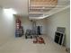 Spacious garage with ample storage, featuring overhead shelving and plenty of room for equipment and tools at 1335 Eureka Mill Run, The Villages, FL 32162