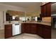 Modern kitchen with sleek stainless steel appliances and seamless integration into the living space at 1335 Eureka Mill Run, The Villages, FL 32162