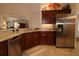 Well-appointed kitchen with stainless steel appliances, granite countertops, and modern fixtures at 1335 Eureka Mill Run, The Villages, FL 32162