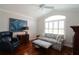 Cozy living room featuring elegant furniture, hardwood floors, and natural light at 1335 Eureka Mill Run, The Villages, FL 32162