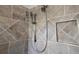 Detail shot of a shower featuring various shower heads, tiled walls and a built-in niche at 1335 Eureka Mill Run, The Villages, FL 32162