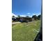 Spacious lawn of charming home with beautiful backyard, great for activities at 1404 Plantation Dr # 9, Lady Lake, FL 32159