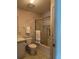Bathroom with a combined tub and shower featuring a glass enclosure, with a toilet and vanity at 1404 Plantation Dr # 9, Lady Lake, FL 32159