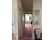 Hallway with a decorative glass window and view into the living area at 1404 Plantation Dr # 9, Lady Lake, FL 32159