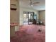 Living space with open layout, leading to bright screened in porch area at 1404 Plantation Dr # 9, Lady Lake, FL 32159