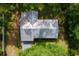 Birds-eye-view of the home, metal roof, decks, and lush landscaping at 1436 Spring Lake Rd, Fruitland Park, FL 34731