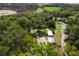 Overhead aerial view showcases the home, outbuildings, and grounds at 1436 Spring Lake Rd, Fruitland Park, FL 34731