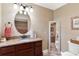 Beautiful bathroom with granite countertop, stylish fixtures, and an adjacent toilet for convenience at 1436 Spring Lake Rd, Fruitland Park, FL 34731