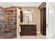 Tastefully designed bathroom features a shower, vanity, dark cabinets, and tile floors at 1436 Spring Lake Rd, Fruitland Park, FL 34731