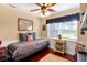 Cozy bedroom featuring a daybed, a window with natural light, and charming decor accents at 1436 Spring Lake Rd, Fruitland Park, FL 34731