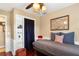 Comfortable bedroom showcasing a twin bed with decorative pillows, closet space, and bright walls at 1436 Spring Lake Rd, Fruitland Park, FL 34731