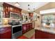 This spacious kitchen has stainless appliances, granite counters, and a breakfast bar at 1436 Spring Lake Rd, Fruitland Park, FL 34731