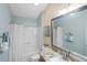Bright bathroom with granite counters, neutral walls, and shower-tub combo for a serene atmosphere at 1664 Vinewood Ave, The Villages, FL 32162