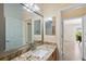 Bathroom showcasing granite countertop, updated fixtures, and ample space, creating a clean and inviting atmosphere at 1664 Vinewood Ave, The Villages, FL 32162