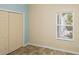Comfortable bedroom featuring a well-lit window and a spacious closet, providing a cozy retreat at 1664 Vinewood Ave, The Villages, FL 32162