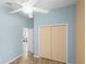 Inviting bedroom with natural light, spacious closet, and ceiling fan for added comfort at 1664 Vinewood Ave, The Villages, FL 32162
