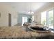 Open floor plan with granite counters, dining table, and living room visible from the kitchen at 1664 Vinewood Ave, The Villages, FL 32162