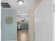 Bright foyer with view to stainless steel kitchen appliances and dining area at 1664 Vinewood Ave, The Villages, FL 32162