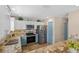 Beautiful kitchen featuring stainless steel appliances, two-tone cabinets, granite counters, and recessed lighting at 1664 Vinewood Ave, The Villages, FL 32162