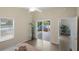 Bedroom with patio access to a hot tub, walk-in closet, and access to the main bathroom at 1664 Vinewood Ave, The Villages, FL 32162