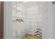 Spacious walk-in closet with ample shelving and storage for well-organized wardrobe and personal items at 1664 Vinewood Ave, The Villages, FL 32162