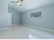Bedroom offers bright natural light, neutral color scheme, and tile flooring at 17037 Se 76Th Creekside Cir, The Villages, FL 32162