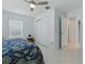 Bedroom with a ceiling fan, window, closet, and tile floors at 17037 Se 76Th Creekside Cir, The Villages, FL 32162