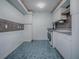 Spacious laundry room featuring washer, dryer, sink and storage cabinets at 17037 Se 76Th Creekside Cir, The Villages, FL 32162