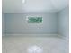 Neutral room features bright natural light and tile flooring at 17037 Se 76Th Creekside Cir, The Villages, FL 32162