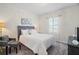 Inviting bedroom with a comfortable bed, a sitting area, and soft carpeting at 17439 Promenade Dr, Clermont, FL 34711