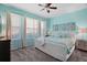 Bright bedroom with plush carpeting, a ceiling fan, and ample natural light at 17439 Promenade Dr, Clermont, FL 34711