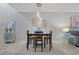 Elegant dining room featuring a modern chandelier and stylish decor at 17439 Promenade Dr, Clermont, FL 34711