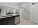 Well-lit kitchen with granite countertops, stainless steel appliances, and neutral tile flooring at 17439 Promenade Dr, Clermont, FL 34711