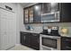 Modern kitchen featuring stainless steel appliances and granite countertops at 17439 Promenade Dr, Clermont, FL 34711