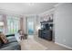 Comfortable living room with tile floors and a view of the backyard at 17439 Promenade Dr, Clermont, FL 34711