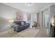 Cozy living room with a comfortable sofa and a view of the patio at 17439 Promenade Dr, Clermont, FL 34711