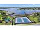 Aerial view of community amenities with tennis courts, playground, and waterfront access at 17439 Promenade Dr, Clermont, FL 34711