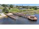 Waterfront view features a boat ramp, long dock and gazebo, perfect for lake access and relaxation at 17439 Promenade Dr, Clermont, FL 34711