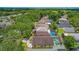 The aerial view showcases homes with private pools, mature trees, and manicured lawns in a suburban community at 1906 Chathamoor Dr, Orlando, FL 32835