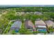 An aerial view shows the neighborhood's well-maintained homes with inviting, screened-in pools and lush landscaping at 1906 Chathamoor Dr, Orlando, FL 32835