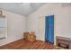 Cozy bedroom featuring wood floors and closet with blue curtain at 1906 Chathamoor Dr, Orlando, FL 32835