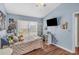 Bright bedroom with a window, laminate floors, and ample space for personal touches at 1906 Chathamoor Dr, Orlando, FL 32835