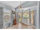 Bright dining area features large windows with decorative curtains and a charming built-in cabinet at 1906 Chathamoor Dr, Orlando, FL 32835