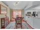 Cozy dining area with a round table, wood floors, and modern lighting fixtures at 1906 Chathamoor Dr, Orlando, FL 32835