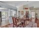 Charming dining area with wood floors, adjacent to an open kitchen, creating an inviting atmosphere at 1906 Chathamoor Dr, Orlando, FL 32835