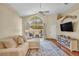 Bright living room with a view of the pool area and cozy sectional at 1906 Chathamoor Dr, Orlando, FL 32835