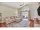 Bright living room with a view of the pool area and cozy sectional at 1906 Chathamoor Dr, Orlando, FL 32835