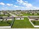 Aerial view of a neighborhood highlighting the home's location in a community at 1940 Piedmont Ct, Mascotte, FL 34753
