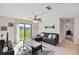Comfortable living space with plenty of natural light and a sliding glass door leading to the outside at 1940 Piedmont Ct, Mascotte, FL 34753